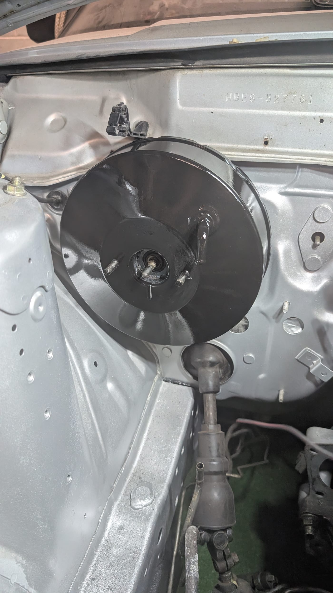 Bare engine bay with the HB chassis stamp