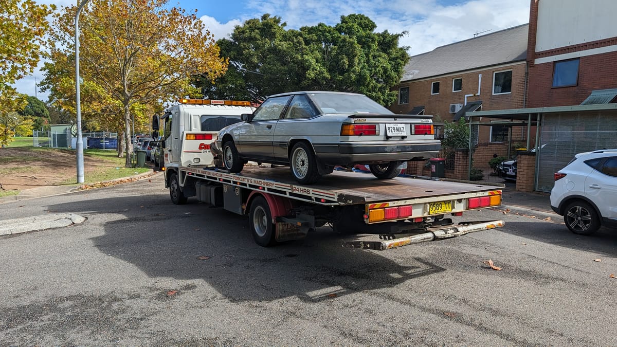 The 929 on a flatbed into the workshop